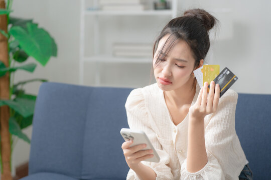 Credit card debt concept. Stressed woman holding multiple credit cards, facing financial problems and debt management. Credit, debt, finance, budgeting, payment