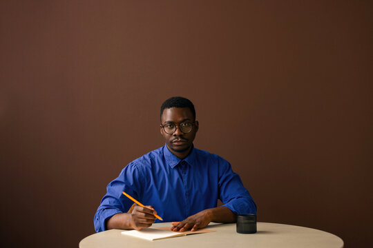Business Professional Writing Notes at Desk