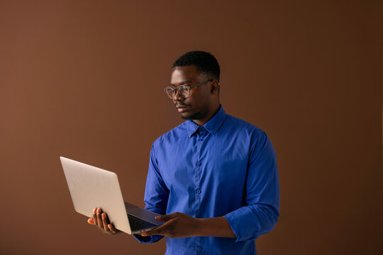 Professional Man Working on Laptop in Studio