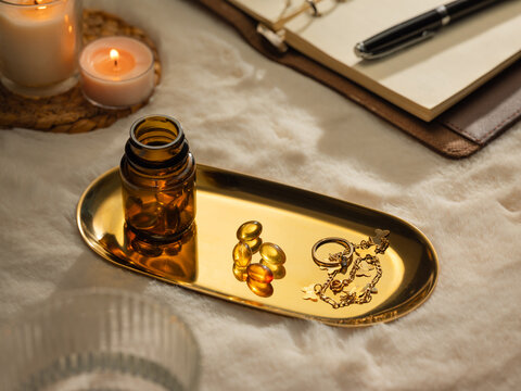 Elegant display of wellness products and accessories on a golden tray