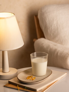 Warm and cozy living space with milk, vitamins, and soft lighting