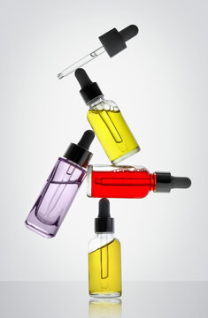 Skincare Dropper Bottles and Pipettes in Balanced Composition