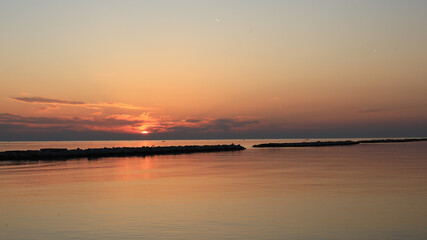 Fototapeta premium Golden Sunrise Reflection on Calm Adriatic Sea in Bari Italy