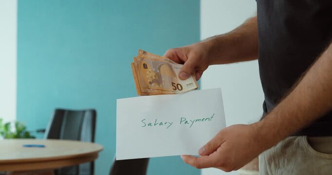 Person receiving euro banknotes with a salary payment document, representing wages, monthly income, employee compensation and cash payment.