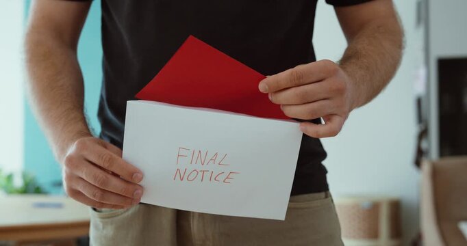 Person holding a final notice letter with a red envelope, representing overdue payments, debt collection, financial warning and urgent payment demand.
