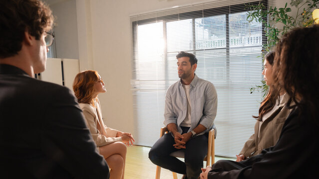 Business teamwork meeting in a modern office where diverse professionals review reports and discuss strategy, collaboration, leadership, planning, productivity, corporate analysis and growth.