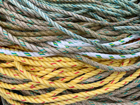 Coiled ropes full frame background. Quayside Ilfracombe harbour, Devon, UK