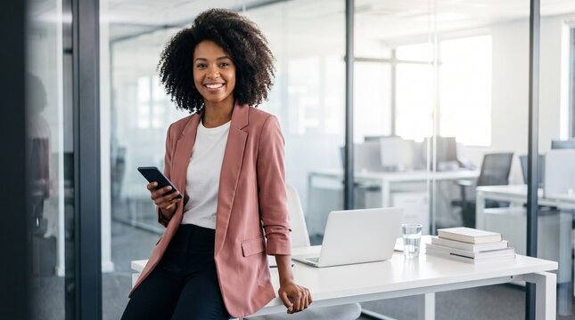 Smiling businesswoman holding smartphone in modern office, professional woman using mobile