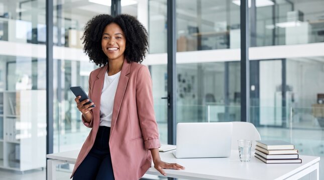 Smiling businesswoman holding smartphone in modern office, professional corporate portrait.