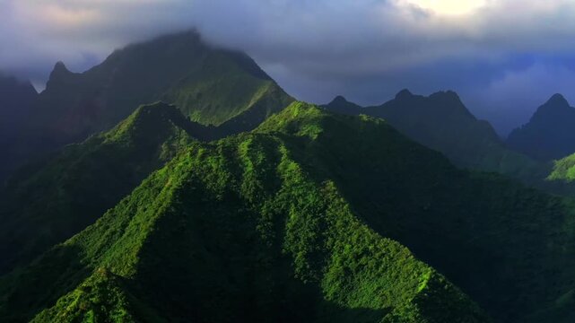 Towering mountains peaks of Teahupo'o Tahiti Ito Volcano landscape South Pacific Island French Polynesia aerial drone sunset clouds Tara Huhurahi Ridge Mount Ronui Aorai Orohena Vaiau River Valley pan