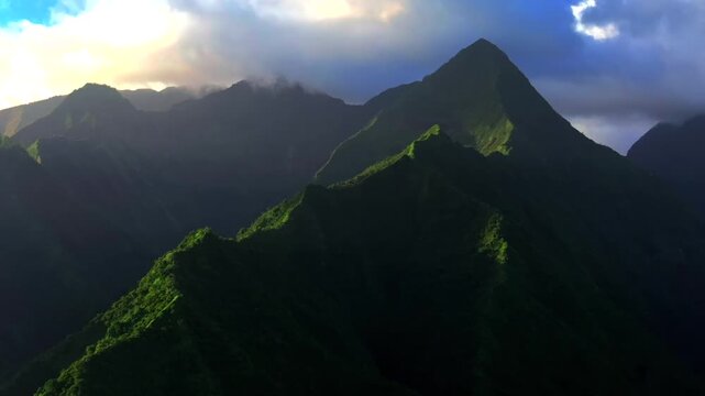 Towering mountains peaks of Teahupo'o Tahiti Ito Volcano ridges South Pacific Island French Polynesia aerial drone sunset clouds Tara Huhurahi Mount Ronui Aorai Orohena Vaiau River Valley circle