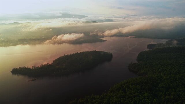 Lake Schroon sunset WOL Clarks Island aerial drone summer golden hour mist low clouds harbor view Up State New York landscape Town of Schroon Lake Pharaoh Mtn Adirondack Mountains circle left motion