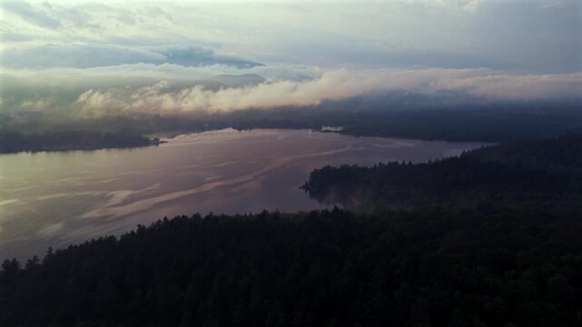Sunset Lake Schroon Steep Bay Clarks Island aerial drone summer golden hour mist low clouds harbor view Up State New York landscape Town of Schroon Lake Pharaoh Mtn Adirondack Mountains backwards