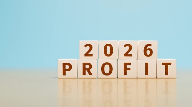 Wooden toy cubes forming the text "2026 PROFIT". Concept for earnings, income, profit reached or planned for the year 2026 of an organisation or company. Dolly Camera