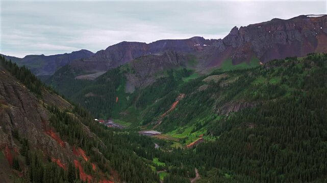 mining Revenue Virginus Yankee Boy Basin 4wd high alpine terrain Telluride Ouray Southern Colorado aerial drone view Rocky Mountains San Juan Range landscape summer low rainy clouds forward