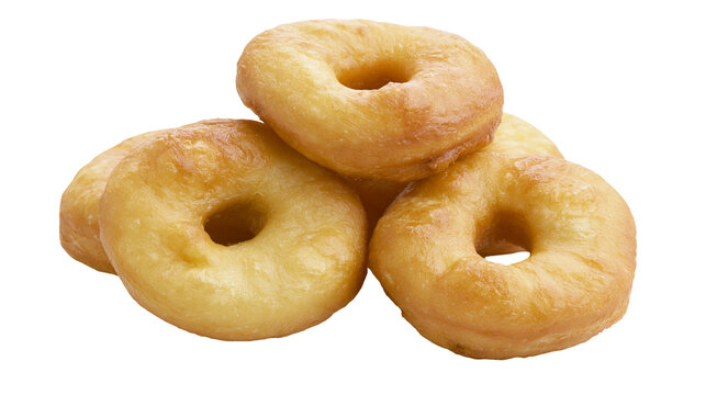 Golden brown fried ring donuts stacked together