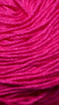 A close-up shot of a ball of yarn. Rotating in a circle