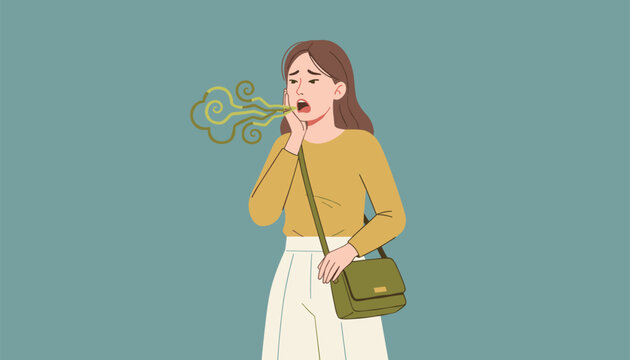 Embarrassed young woman suffering from bad breath and toothache holding her hand to her cheek with a worried look.