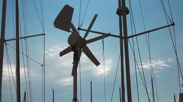 marine wind generator or wind turbine mounted on a sailboat's stern arch