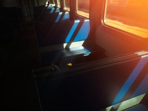 Dramatic light rays in train car interior background