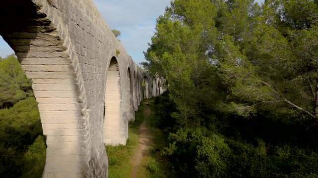 Aerial Drone Dolly In Along Saint Cl&eacute;ment Aqueduct Arches in Montpellier France