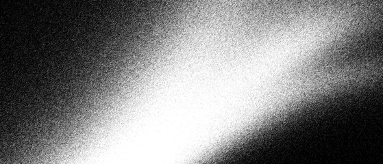Obraz premium Grainy black and white light leak texture, cinematic film grain overlay with soft glow. Abstract monochrome smoke effect on dark background. Vintage analog photography aesthetic for overlays.