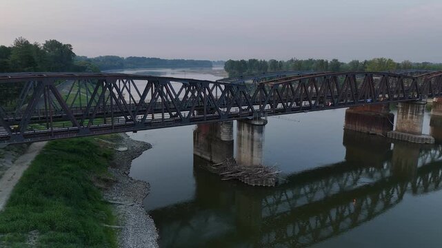 Po River shows exposed banks and unusually low water beneath the Cremona iron bridge during the 2026 drought, Cremona, Lombardy, Italy, Europe, static shot