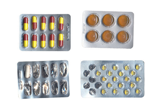Four medicine blister packs with various pills on a transparent background