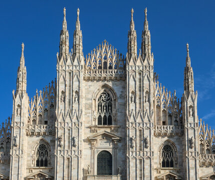 Architectural detail of the Gothic facade and spires of the Milan Cathedral Duomo di Milano in Italy