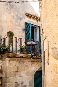 Picturesque street in the historic center of Otranto, with traditional buildings and a relaxed atmosphere reflecting the slow pace of life, Otranto, Salento, Puglia, Italy.