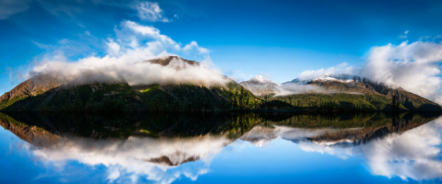 Alaska summer mountain landscape, cloudscape and water reflection in Denali wilderness area