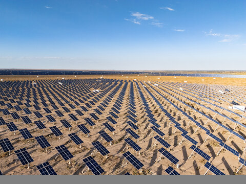 Neatly arranged solar photovoltaic panels in the desert generating clean energy