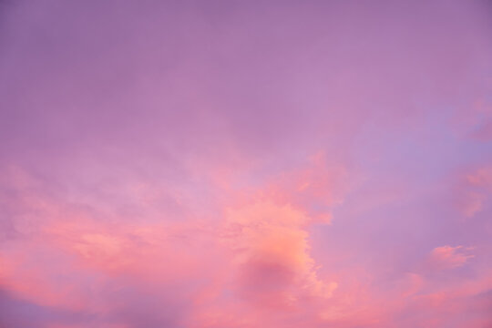 Sunset sky background with pink purple cloud and soft light, colorful pastel dusk atmosphere with dramatic evening color, abstract nature wallpaper for summer, autumn, Winter sunrise  twilight design.