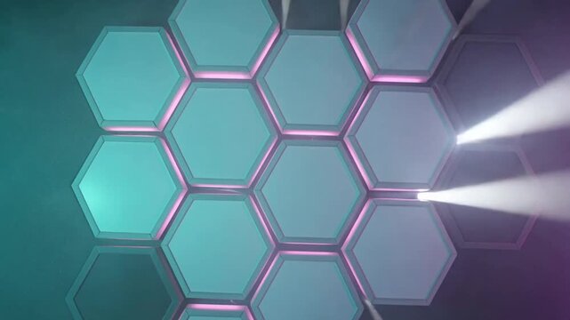 Firing spotlights sweeping beams across hex wall in studio, revealing pink rims and teal purple fog