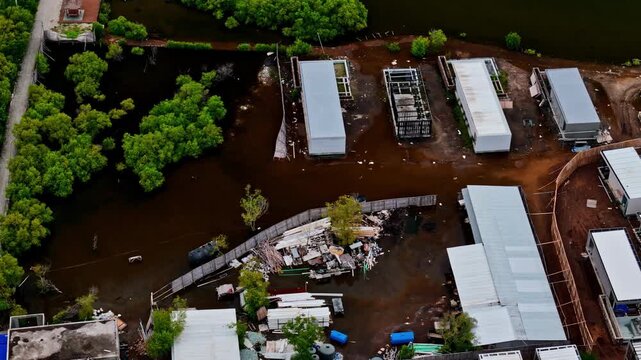 Aerial view of modular buildings on Gili Meno, with some structures surrounded by flooded ground and scattered debris in Pemenang, West Nusa Tenggara, Indonesia.