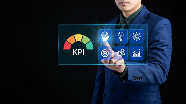 Executive interacting with a digital interface measuring key performance indicators.