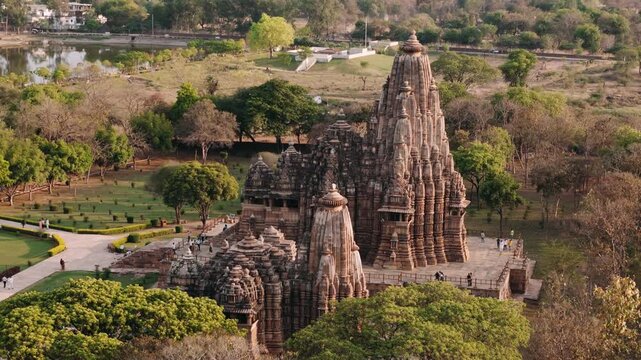Aerial view of the ancient hindu temples of khajuraho group of monuments at sunset, a unesco world heritage site in madhya pradesh, india