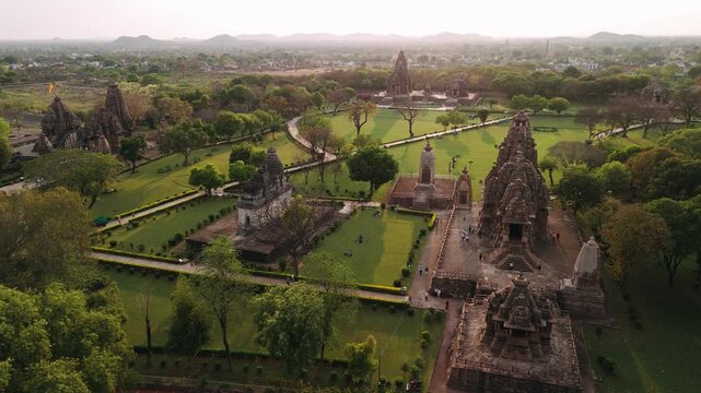Aerial view of the ancient hindu temples of khajuraho group of monuments at sunset, a unesco world heritage site in india