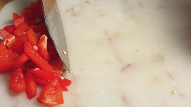 Whole red bell pepper diced and sliced into pieces