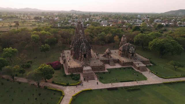 Aerial view of the historic khajuraho temples in india with tourists visiting the ancient monument