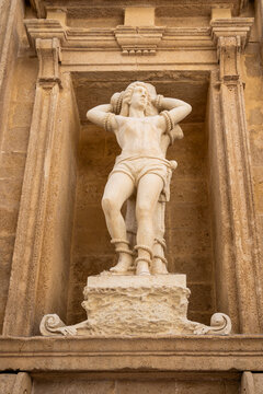 Statue of Saint Sebastian on the facade of the Baroque Cathedral of Saint Agatha, historic center of Gallipoli, Salento, Puglia, Italy.
