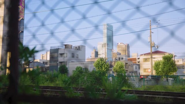 Airin Ward in Osaka, Nishinari. Train tracks looking towards Abeno Harukas
