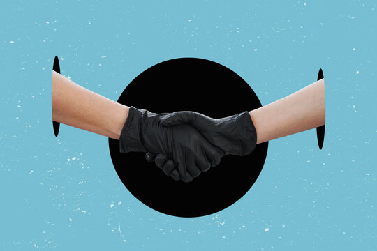 Oil deal concept. A handshake while wearing safety work gloves, isolated on free background.