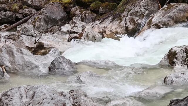 Mountain river water flowing through rocks