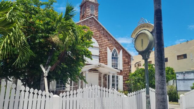 Historic Methodist Church on Front Street in Philipsburg, St. Maarten, featuring a wooden facade, Caribbean colonial architecture and lush tropical vegetation on a sunny day in paradise