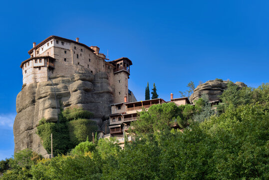 Low angle view of the Monastery of Rousanou built on a rock pillar in Meteora Greece