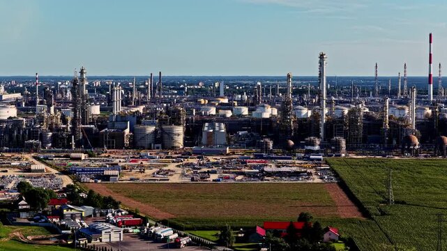 Aerial view of Orlen Plock Production Plant with industrial infrastructure, storage tanks, and chimneys in Plock, Mazowieckie, Poland.