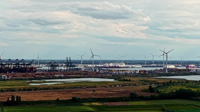 Aerial view of the Doel Nuclear Power Plant and surrounding wind turbines along the Scheldt river in Beveren-Kruibeke-Zwijndrecht, Vlaanderen, Belgium.