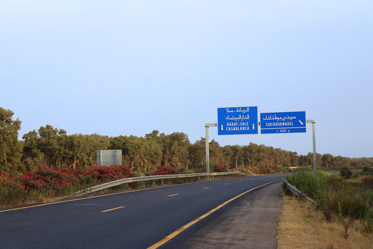 Moroccan highway between Kenitra and Rabat with signs to Rabat, Casablanca and Sidi Bouknadel