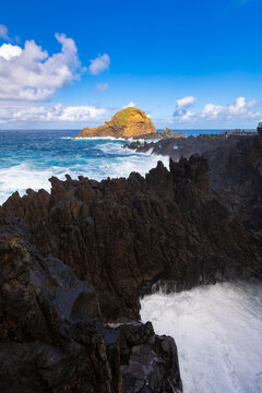Natural volcanic rock pool under a blue sky, Madeira (Portugal) &ndash; travel background or wallpaper